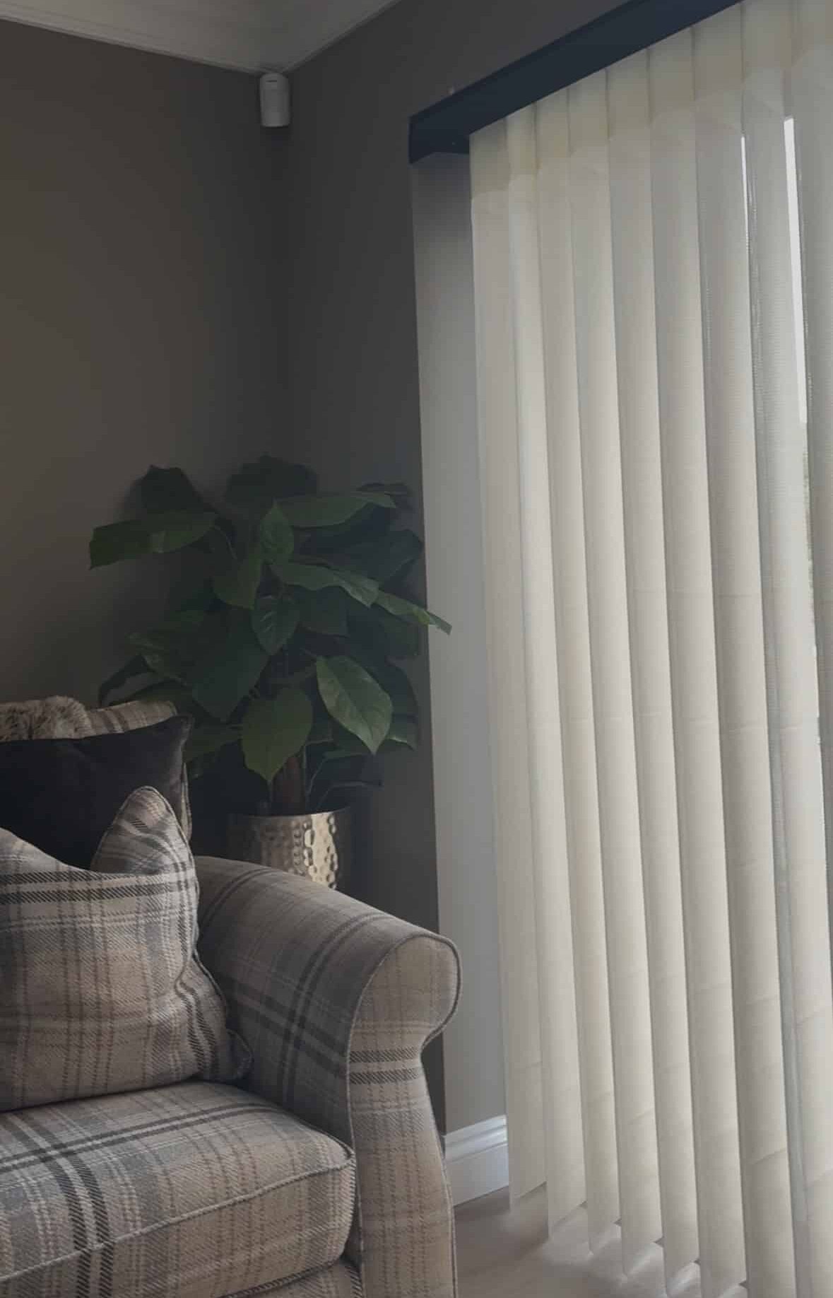 this image of a cosy living room featuring newly installed beige allusion blinds