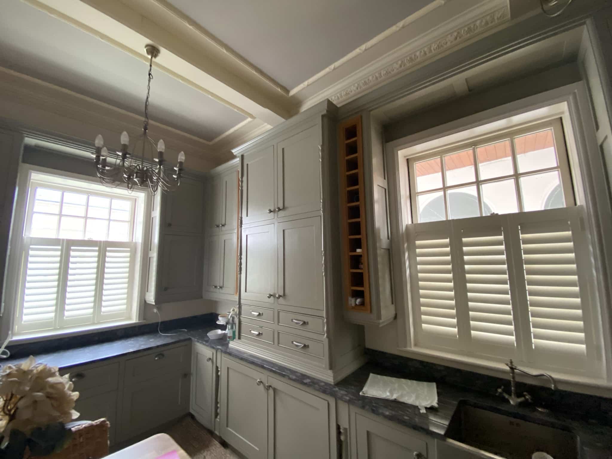 Cafe-style white shutters in an elegant kitchen