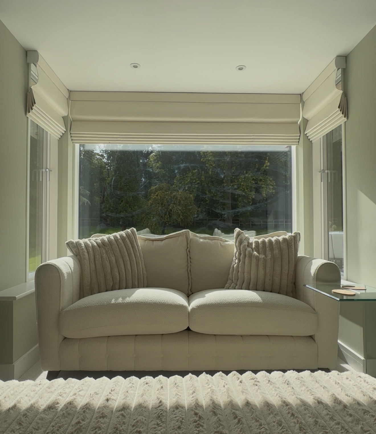 Made-to-measure blinds surrounding a bright bay window