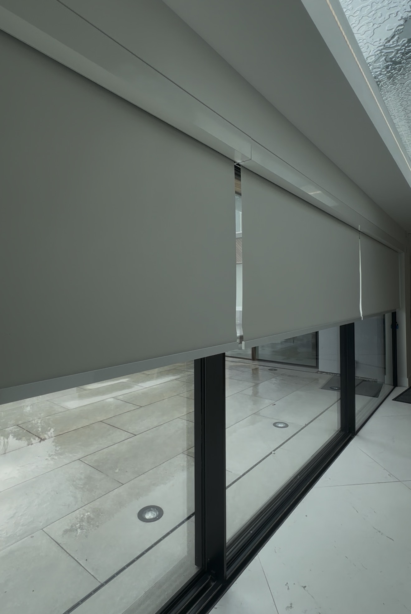 Made-to-measure blinds fitted across wide glazed doors